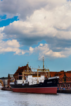 Museum bulk carrier ship Soldek moored at Old Motlawa River embankment in Gdansk, Poland