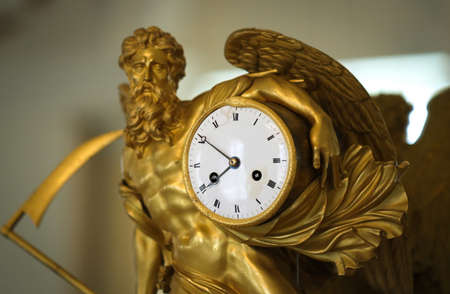 Antique gilded fireplace clock from beggining of XIX centuryの写真素材