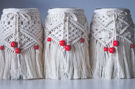 Macrame hand woven with cord white lanterns in a rowの写真素材