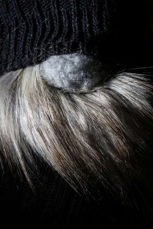 Hand made with socks christmas gnome with beard, nose and eyes on white backgroundの写真素材