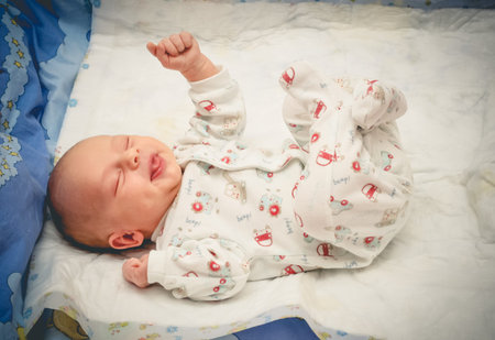 Newborn baby infant is ready for sleep after bath