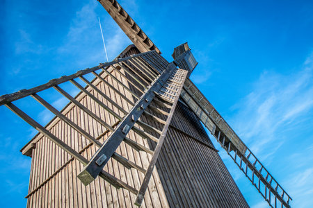 Old wooden windmill made in 1864, type "post mill" earliest of european windmillsの写真素材