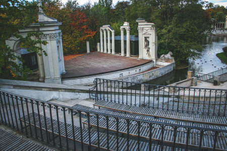 Stage of roman influenced outdoor amphitheater on the water in Royal Baths Park in Warsaw seen from auditoriumの写真素材