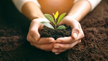 This image captures the essence of nurturing and growth, showing a pair of hands gently cradling...