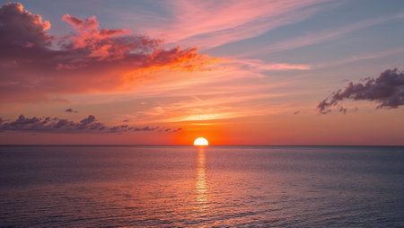 Vibrant sunset over a tranquil ocean, creating a beautiful and serene scene. AI generated imageの素材