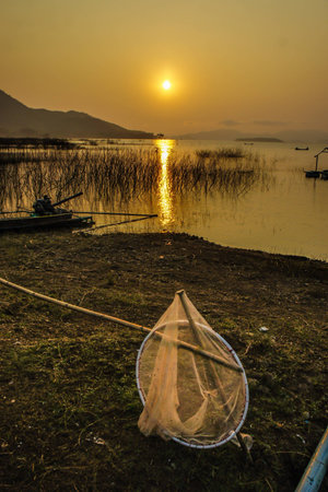 sunset at lake, thailandの写真素材