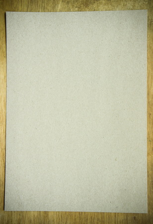 Brown paper on wood textureの写真素材