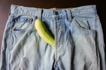 cucumber is the mark of penis in Jeansの写真素材