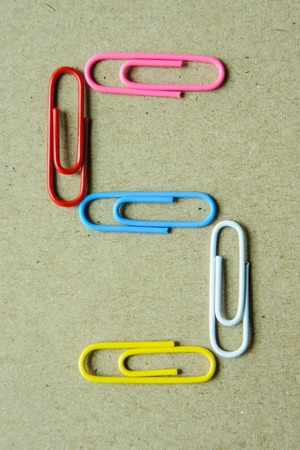 Number five of paper clip on brown paper backgroundの写真素材