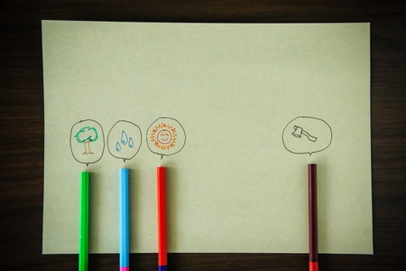 pencil with a speech bubble isolated on brown paper backgroundの写真素材