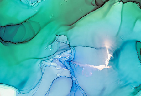 Alcohol ink abstract background. Blue, green and white liquid texture.の素材