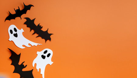Halloween background with ghost and bats. Top view, copy spaceの素材