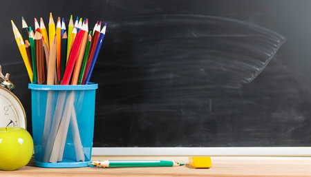 Colorful chalk on blackboard background. Back to school concept.の素材