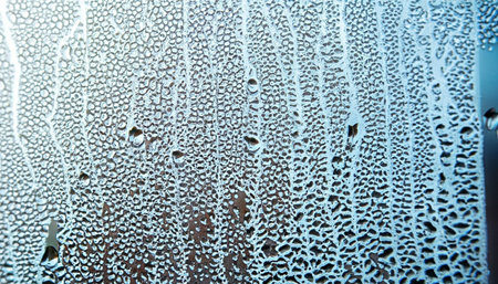 Water drops on a window glass. Abstract background and texture for design.の素材