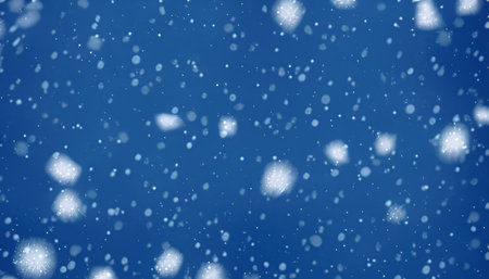 Winter background with falling snowflakes. Falling snowflakes on blue backgroundの素材
