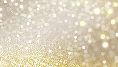 Golden glitter background with bokeh defocused lights and stars.の素材