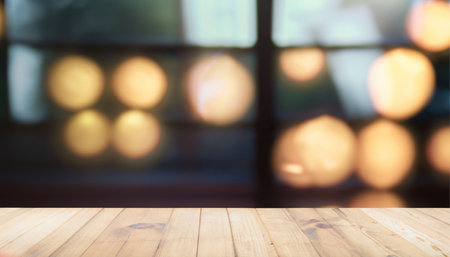 Empty wood table top with abstract blurred bokeh light background.の素材