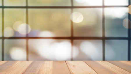Wooden table top on blur background with bokeh image.の素材