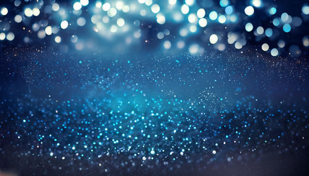abstract blue bokeh background with glitter defocused lights and starsの素材