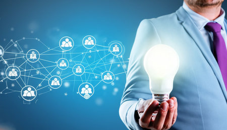 View of a Businessman holding a lightbulb with social network connection - Technology conceptの素材