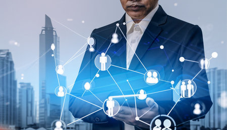 Double exposure of businessman using tablet and social network structure with cityscape backgroundの素材