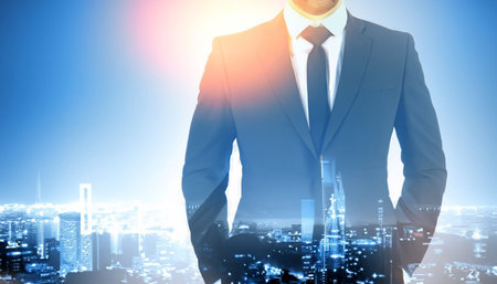 Double exposure of businessman standing over cityscape background. Success concept.の素材