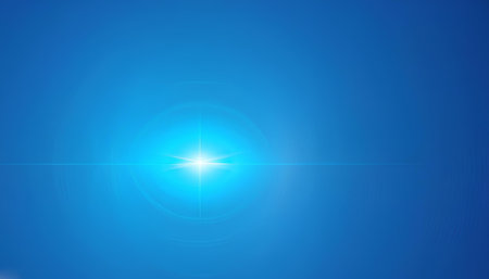 sunlight on a blue background with lens flare and space for textの素材
