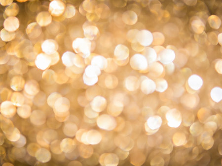 Abstract gold bokeh background. Christmas and New Year concept.の素材