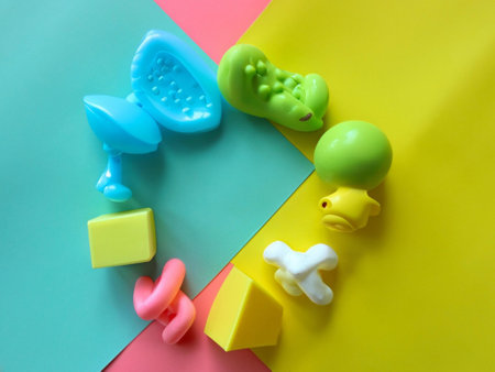Colorful baby toys on colorful background. Top view. Flat layの素材