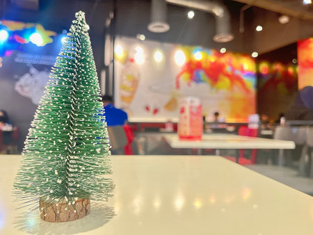 Christmas tree decoration on the table in coffee shop blur background with bokehの写真素材