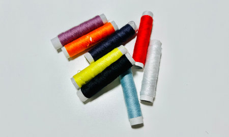 spools of thread on a white background, closeup of photoの写真素材