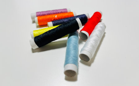 Spools of thread on a white background, close-up.の写真素材