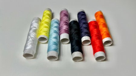 spools of thread on a white background. colored threads for sewingの写真素材