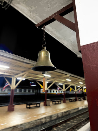 The bell on the platform of the railway station at night, Thailand.の写真素材