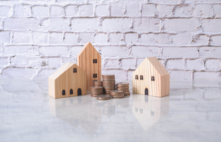 Real estate or home savings and coin piles flowing, property investment and home mortgage financing...