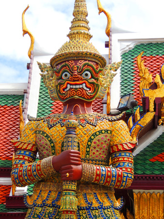 Statue of a giant Thai standing in the Emerald Buddha, Bangkok, Thailand.の写真素材