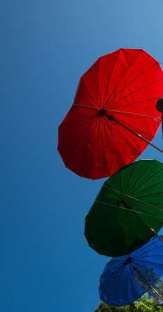 Three umbrella - three color red, green and blue of differentの写真素材