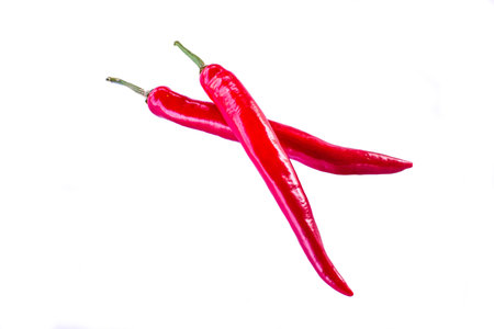 Isolated fresh cayenne pepper on white background