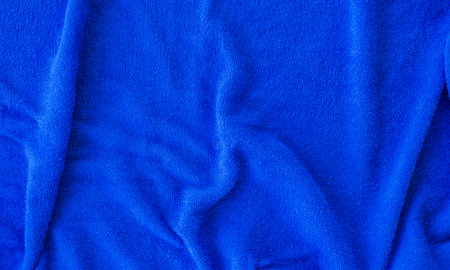 Blue soft towel texture cotton fabric for background. Take a closeup top view shot.