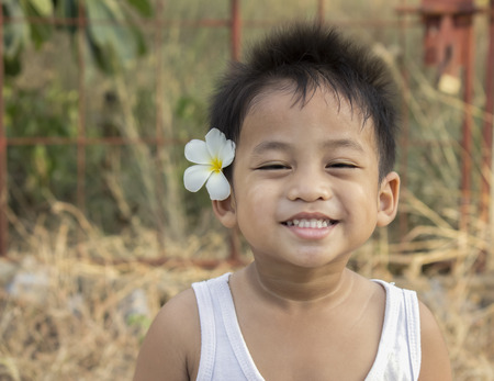 a pleased, kind, or amused facial expression, typically with the corners of the mouth turned up and the front teeth exposedの写真素材