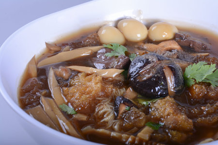 Braised Fish Maw in Red Gravy with crab in bowl on white background.の写真素材