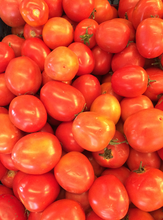 Red tomatoes piled togetherの写真素材