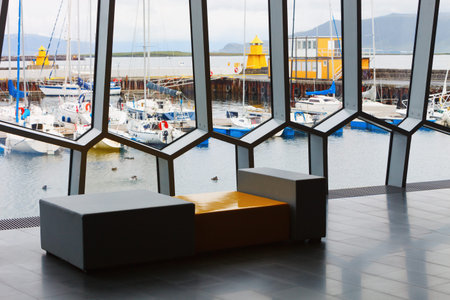 Facade detail of Harpa Concert Hall with view of port Reykjavik, across the windows horizontalのeditorial素材