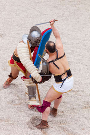 Tarragona, Spain - May 19, 2013: Gladiators on the arena of Roman Amphitheater on May 19, 2013 in Tarragona, Spain. Every year, the historic recreation program TarracoViva recreates a gladiators fightのeditorial素材