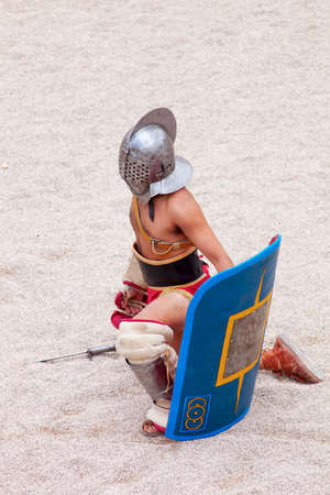 Tarragona, Spain - May 19, 2013: Gladiators on the arena of Roman Amphitheater on May 19, 2013 in Tarragona, Spain. Every year, the historic recreation program TarracoViva recreates a gladiators fightのeditorial素材