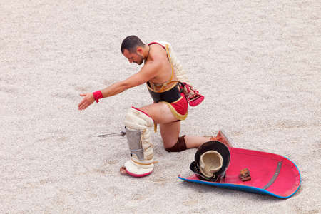 Tarragona, Spain - May 19, 2013: Gladiators on the arena of Roman Amphitheater on May 19, 2013 in Tarragona, Spain. Every year, the historic recreation program TarracoViva recreates a gladiators fightのeditorial素材