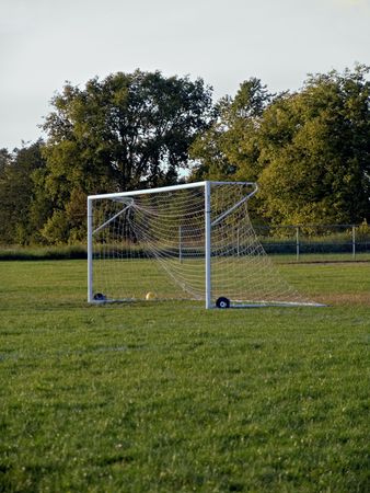 A soccer field and net in a small village. の写真素材
