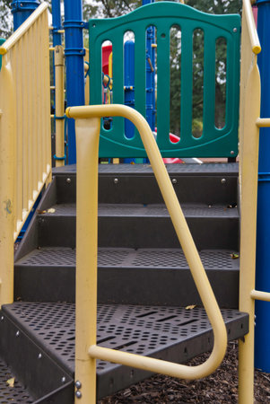 Parts of colorful paly equipment with blues, greens, yellow colors. 