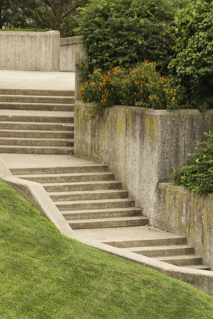 Cement steps leading into a city garden.の写真素材