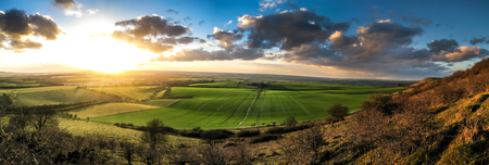 Beautiful sunset over british farm fieldsの写真素材